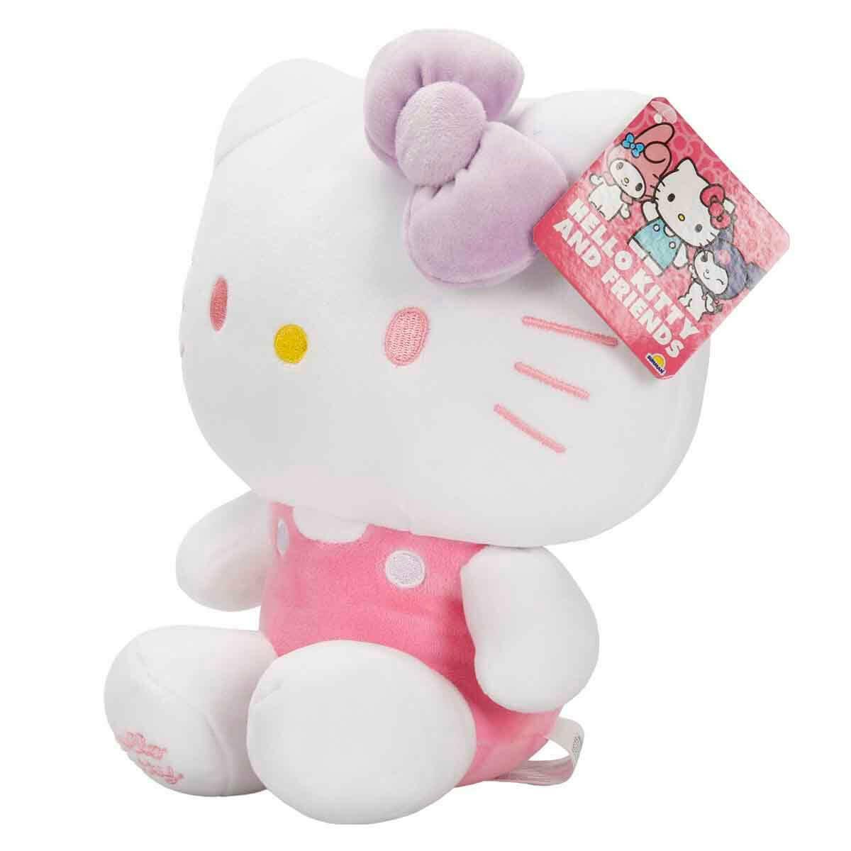 Hello Kitty Pembe Tulumlu Peluş S5 | 22 CM Mor Fiyonklu Figür | Orijinal Tasarım Yumuşak Oyuncak